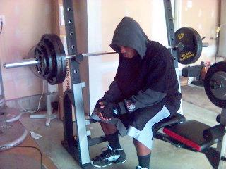 A 2007 photo of me on a weight bench with 95 pounds ready to bench press 