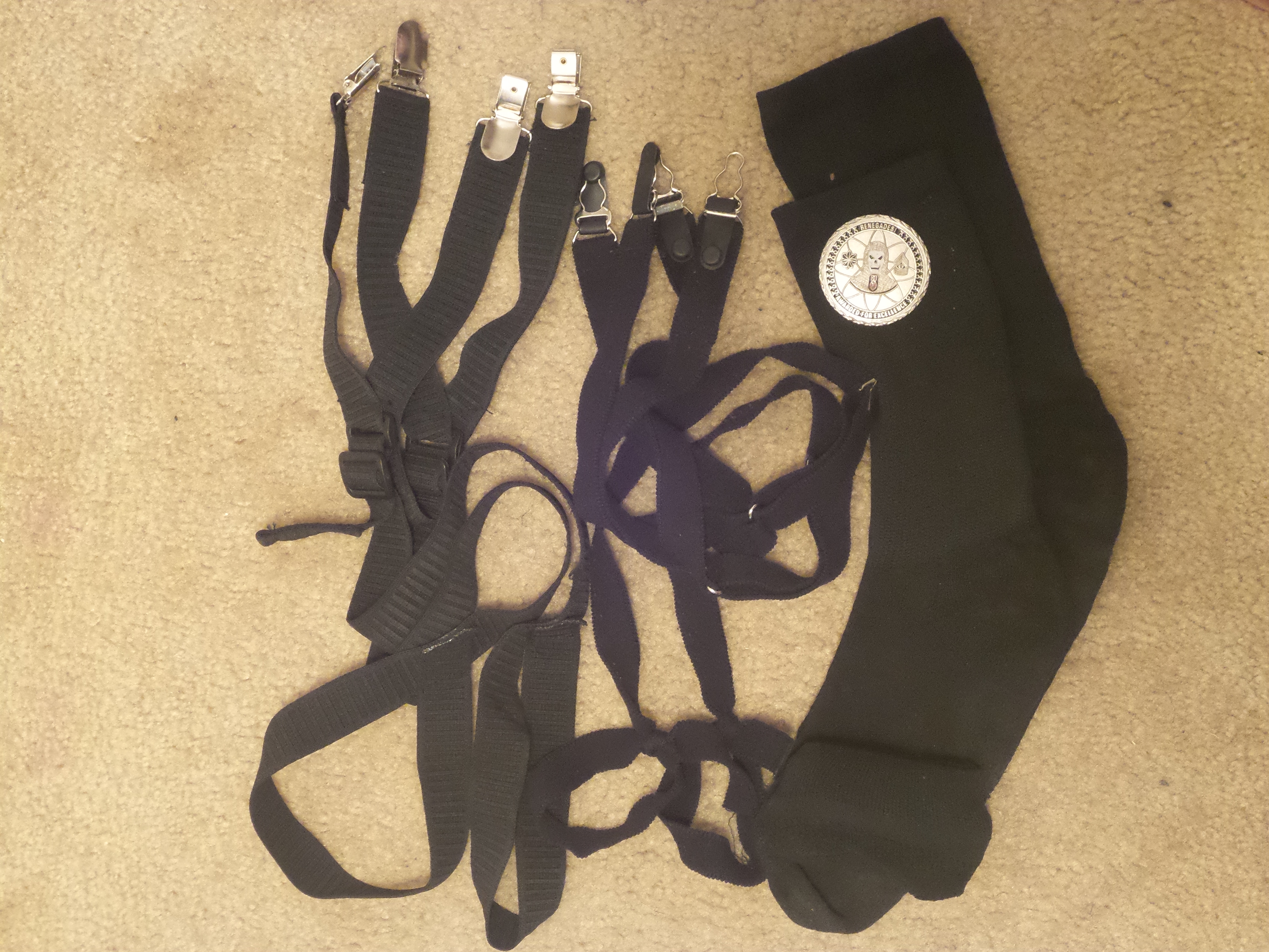 military dress uniform upgrade items - Y and stirrup style shirt stays, black socks, and an EOD challenge coin